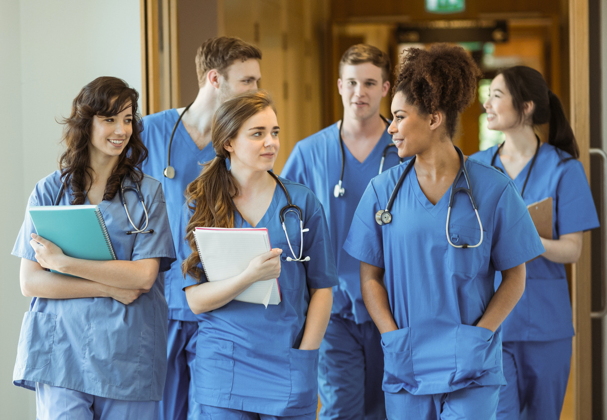 Medical students walking through corridor at the university